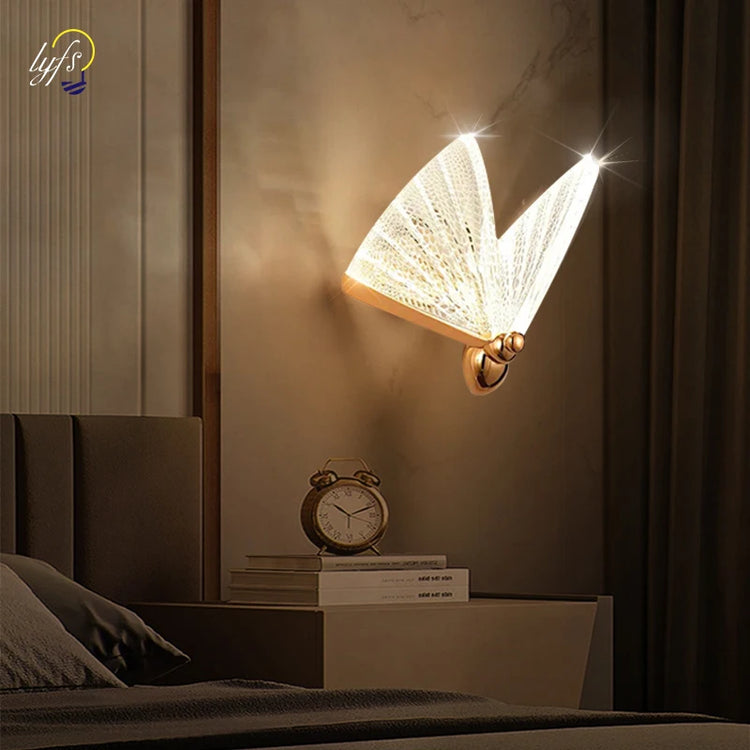A glowing butterfly wall lamp above a bedside table